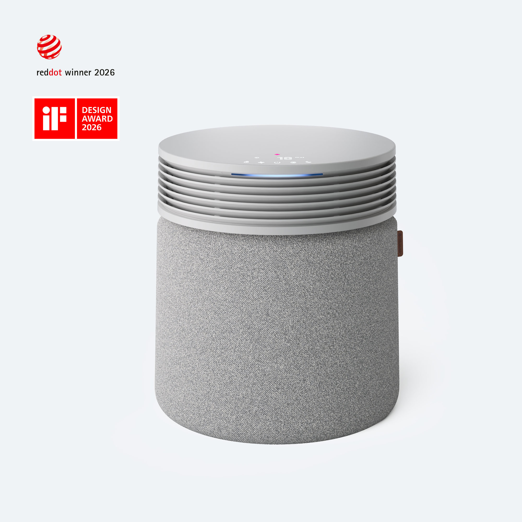 Blueair Blue Signature Large SP4i in Nordic Fog, with a pale woven-fabric lower body, rounded upper air outlet, and flat illuminated tabletop top.